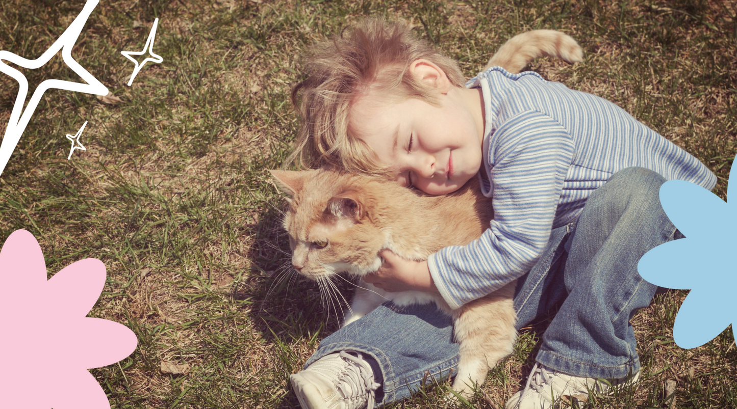 Happy kid cuddling and hugging the cat.